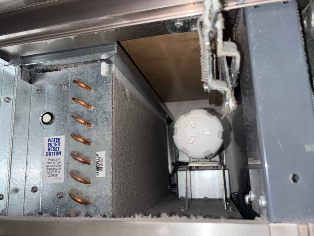 Sub-Zero refrigerator condenser coil before professional cleaning